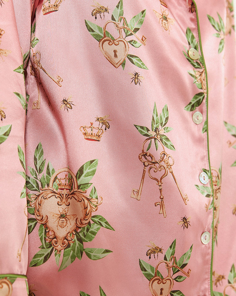 Bella Descanso luxury sleepwear. Biscayne pink luxury pyjama set. Bella Descanso exclusive Biscayne print, featuring Surrounded Islands, Miami-inspired pink and designer-inspired gold bees. 