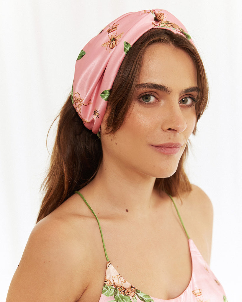 Bella Descanso luxury sleepwear. Biscayne turban headband, the perfect stylish accessory and headband with this striking pink print featuring designer-inspired bees and gold jewellery. 